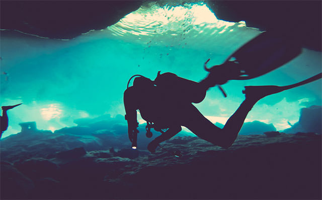 SCUBA-Diver-In-Blue-Water-Silhouette